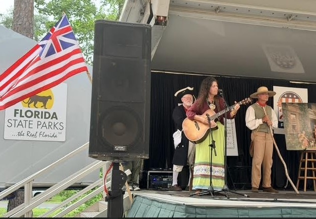 Lee Pinkerson singing a song of the America's 250th Anniversary Stage